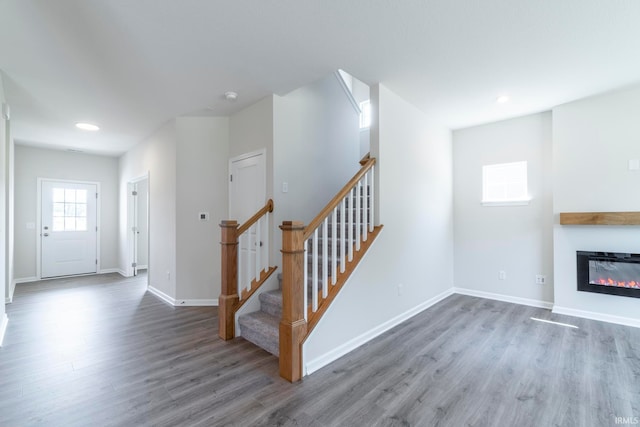 unfurnished living room with hardwood / wood-style flooring