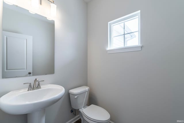 bathroom with toilet and sink