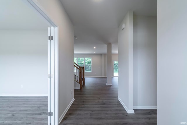 hall with dark hardwood / wood-style flooring