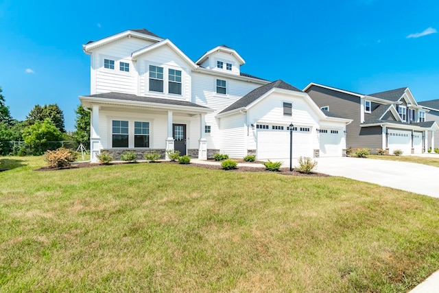 craftsman-style home with a garage, a front yard, and covered porch