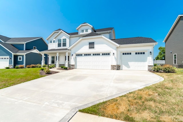 view of front facade with a garage and a front lawn