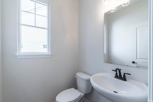 bathroom with toilet and sink