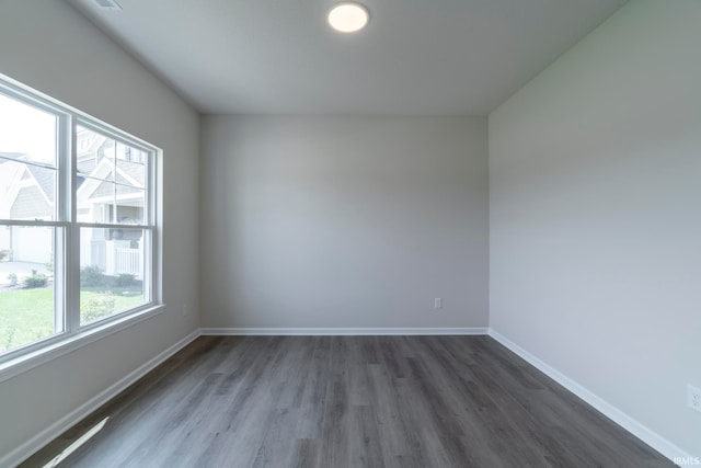 empty room featuring dark wood-type flooring