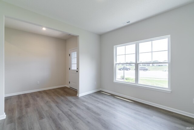 unfurnished room with light hardwood / wood-style floors