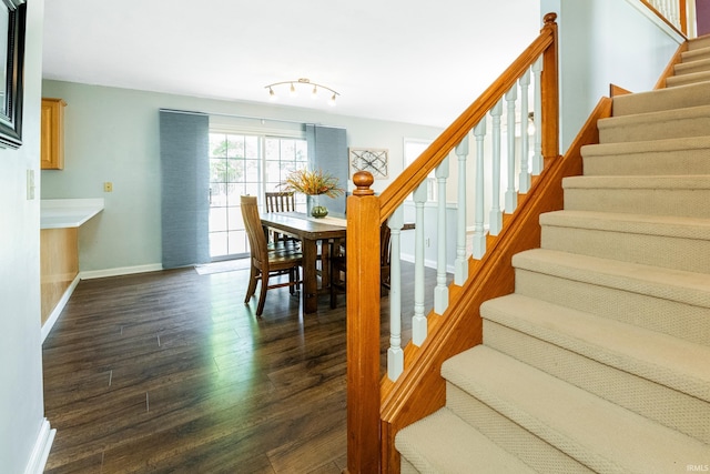 stairway featuring hardwood / wood-style flooring