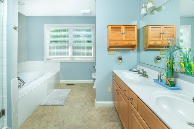 bathroom with vanity, toilet, and a bathing tub