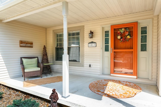 property entrance with covered porch