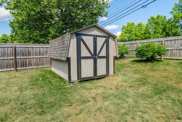 view of outbuilding with a lawn