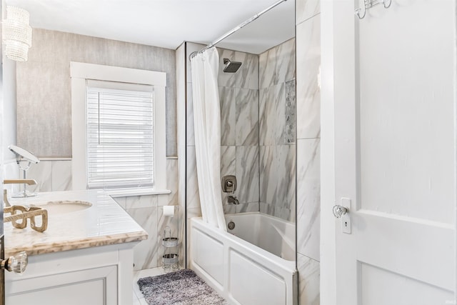 bathroom with tile patterned flooring, vanity, and shower / bath combo with shower curtain