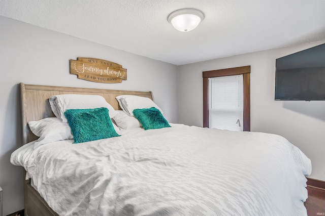 bedroom featuring a textured ceiling