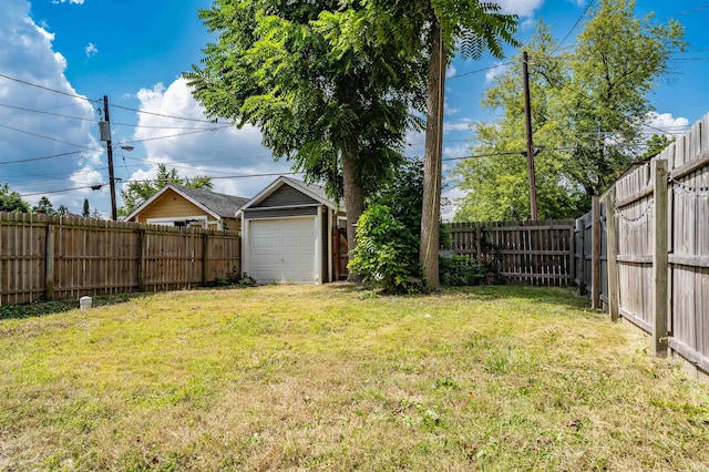 view of yard featuring an outdoor structure and a garage