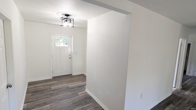 corridor featuring dark wood-type flooring