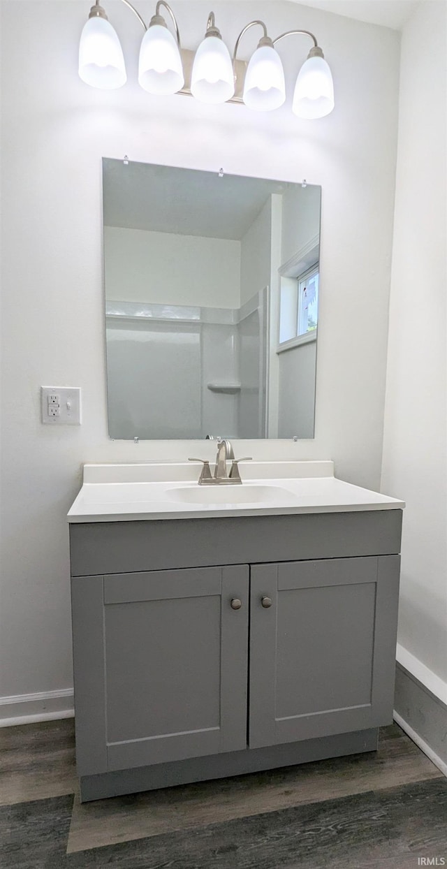 bathroom featuring vanity and hardwood / wood-style flooring