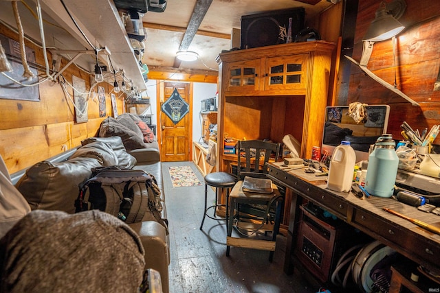 basement with wooden walls and a workshop area