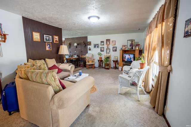 carpeted living room featuring a textured ceiling