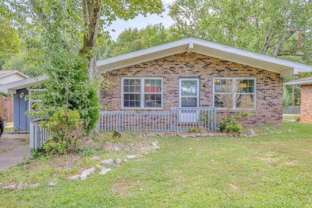 ranch-style home with a front yard