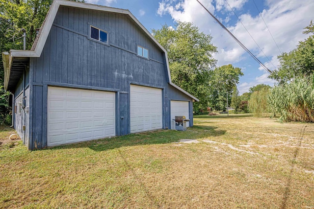 garage featuring a yard