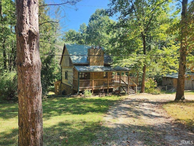 view of front of home with covered porch and a front yard