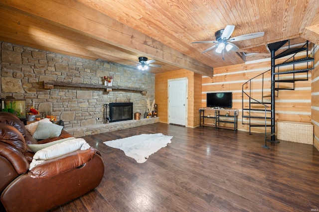 living room with dark hardwood / wood-style flooring, ceiling fan, wooden ceiling, and a stone fireplace