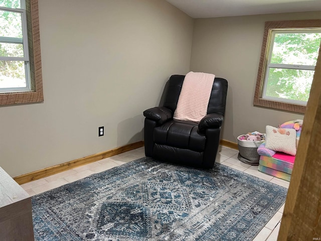 sitting room featuring a healthy amount of sunlight and light tile patterned floors