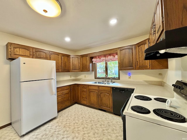 kitchen featuring white appliances and sink