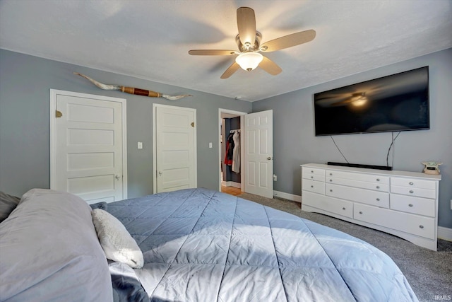 carpeted bedroom with ceiling fan