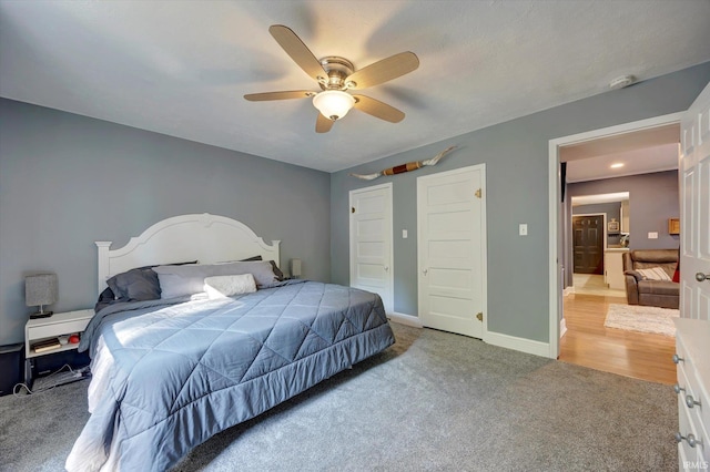 carpeted bedroom with ceiling fan