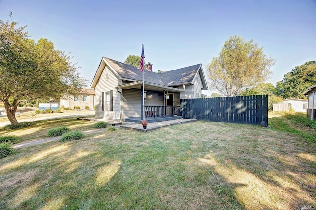 view of side of property with a lawn