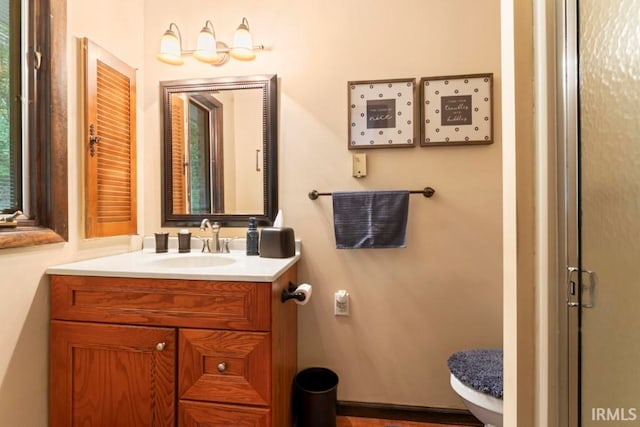 bathroom with vanity and toilet