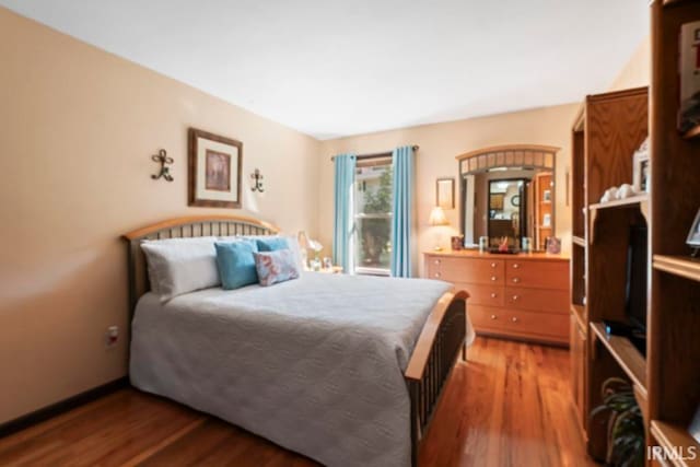 bedroom featuring hardwood / wood-style floors