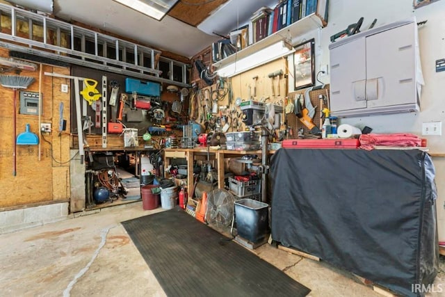 interior space with a workshop area and concrete floors