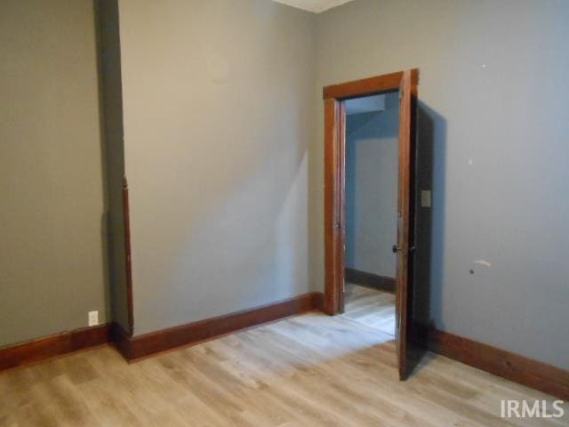 unfurnished room with light hardwood / wood-style flooring