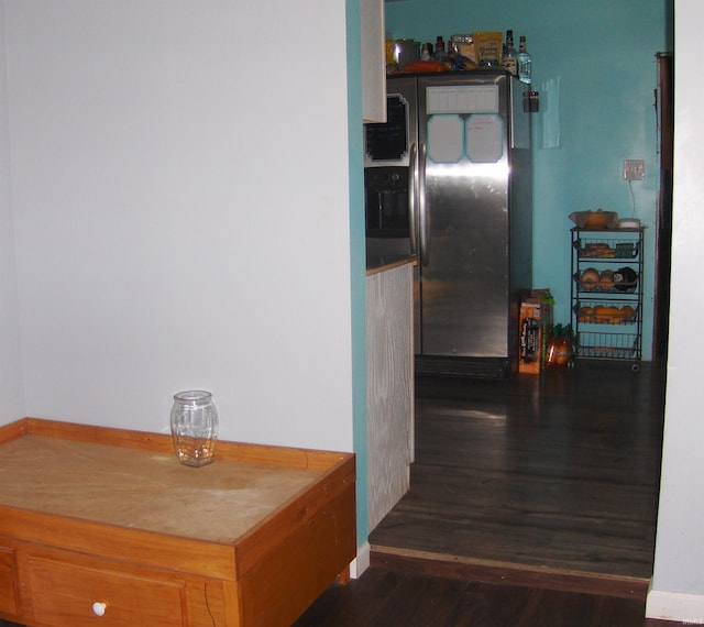 hallway with dark hardwood / wood-style floors