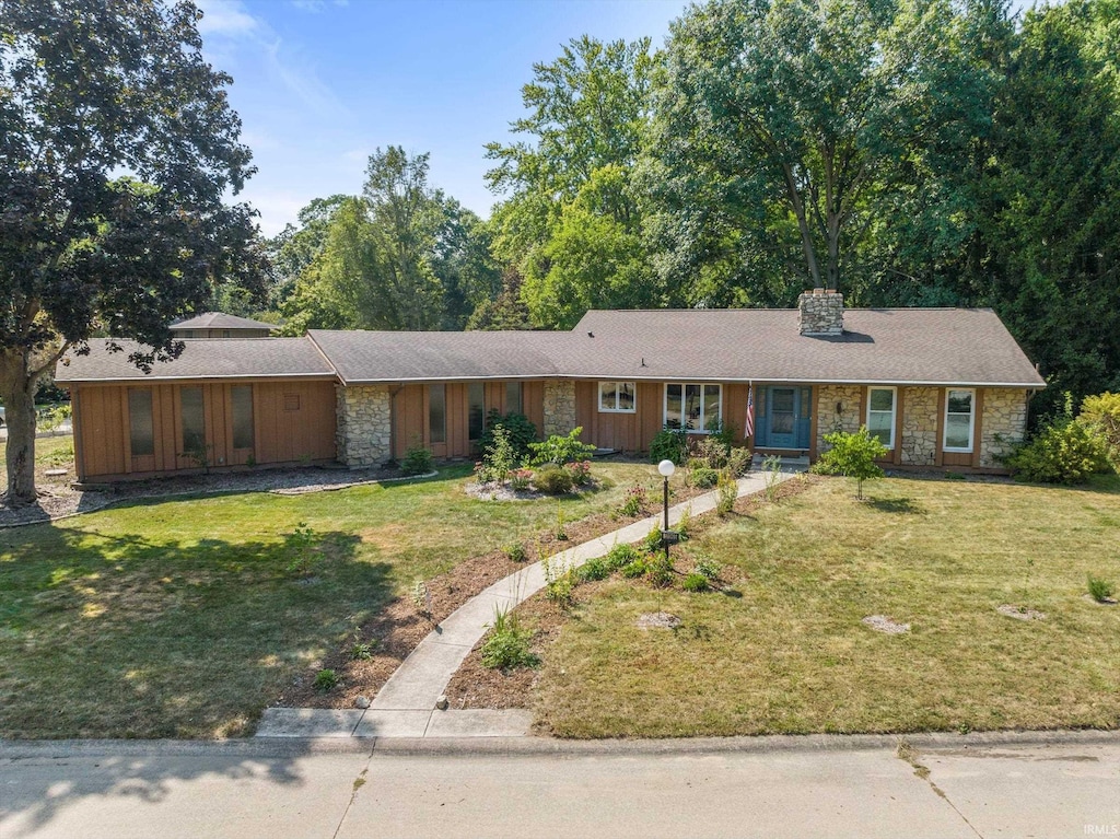 ranch-style home with a front lawn