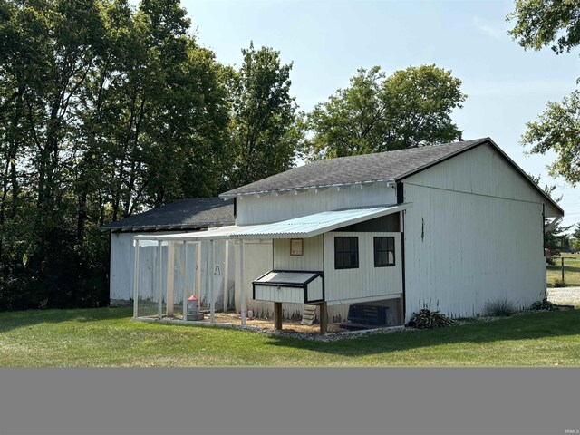 view of outdoor structure with a lawn