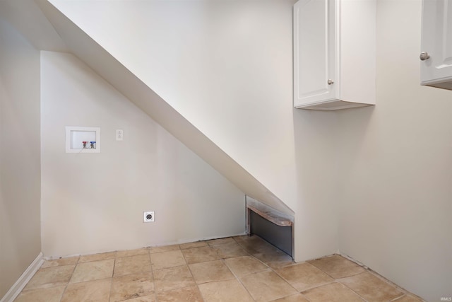 laundry room featuring hookup for a washing machine, cabinets, and hookup for an electric dryer