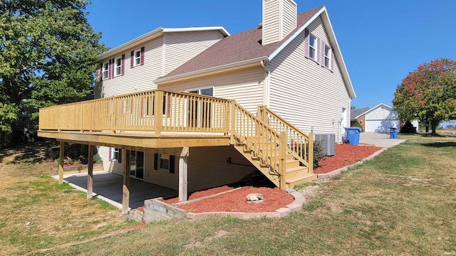 back of house featuring cooling unit, a yard, a patio area, and a deck