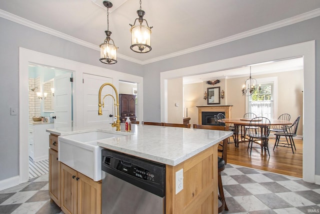 kitchen with pendant lighting, ornamental molding, a chandelier, a center island with sink, and stainless steel dishwasher