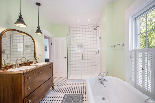 bathroom with vanity, tile patterned flooring, and shower with separate bathtub