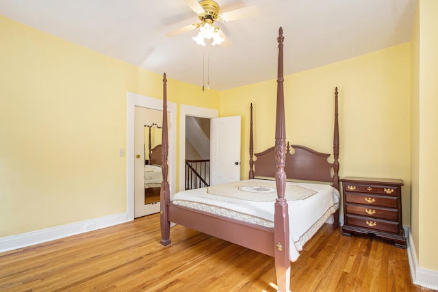 bedroom with hardwood / wood-style floors and ceiling fan