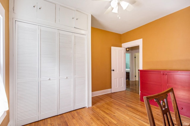 bedroom with light wood-type flooring, a closet, and ceiling fan