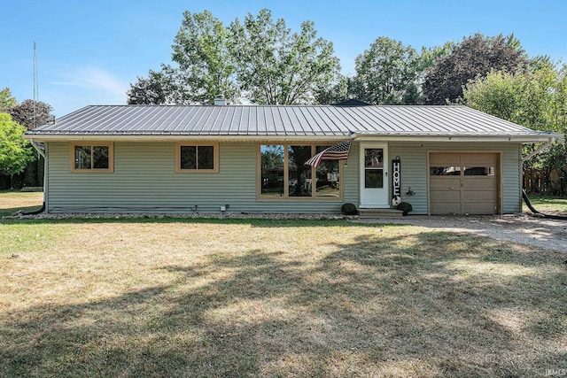 single story home with a front yard and a garage