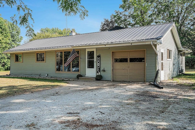 ranch-style home featuring a garage