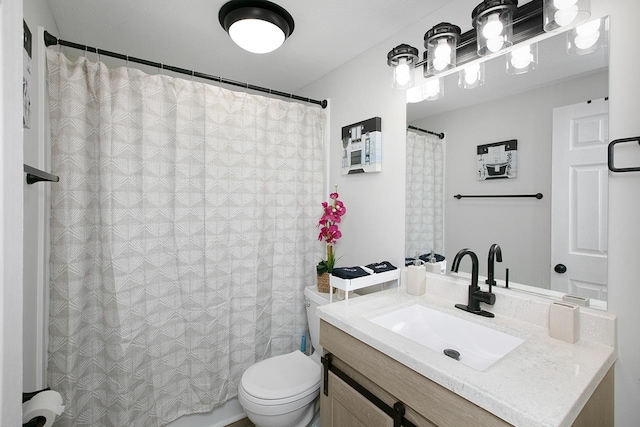 bathroom with vanity, toilet, and a shower with curtain