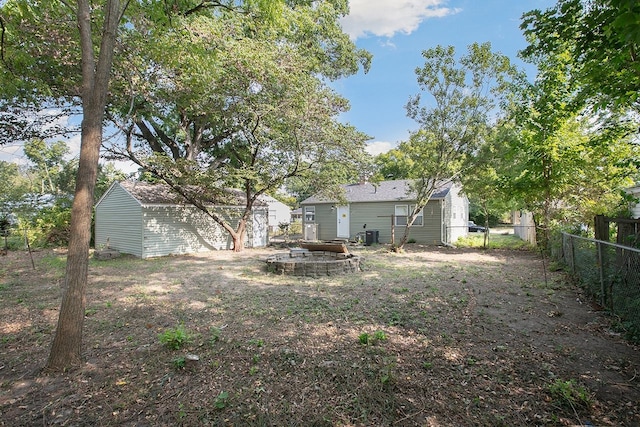 view of yard with a fire pit