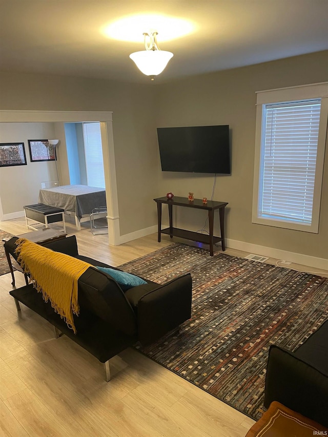 living room with light hardwood / wood-style floors