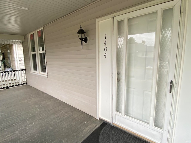 doorway to property featuring a porch