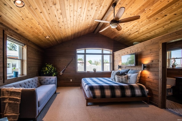 carpeted bedroom featuring wooden ceiling, multiple windows, vaulted ceiling, and ceiling fan