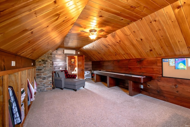 unfurnished room with light carpet, a wall mounted AC, wood walls, and wooden ceiling