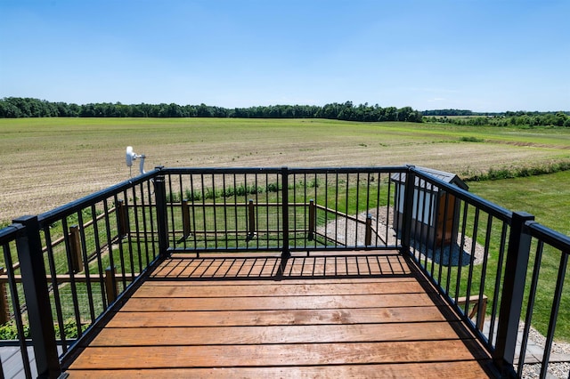 wooden terrace featuring a rural view